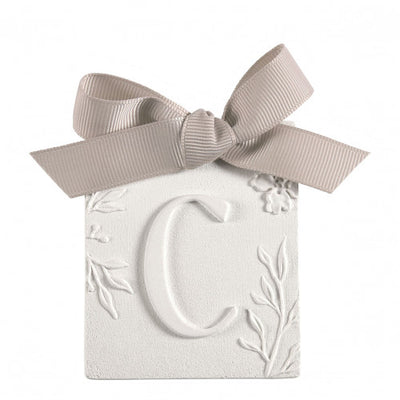 Scented detail Initial with bow