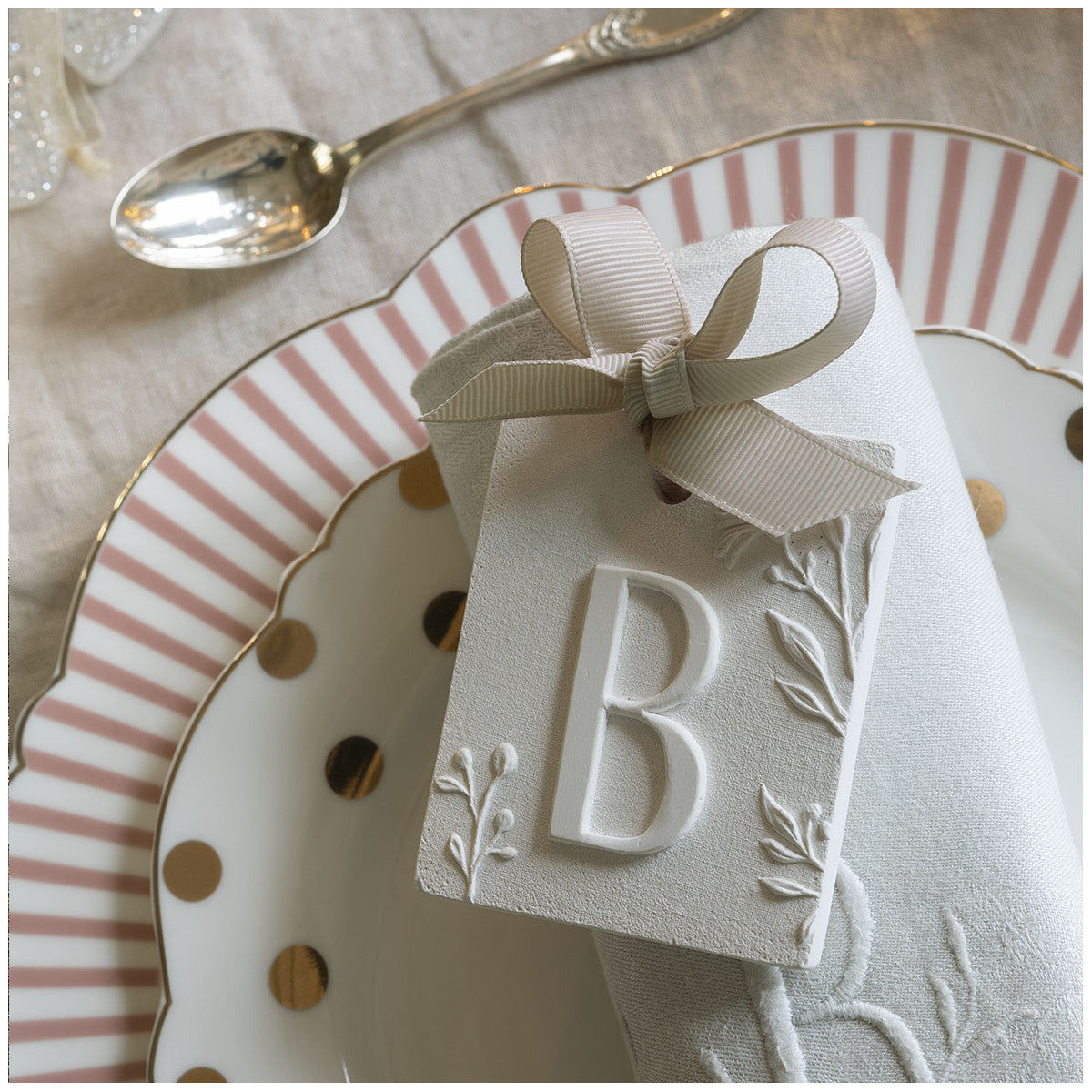 Scented detail Initial with bow