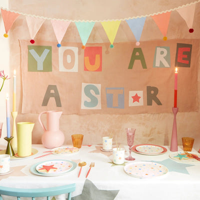 Multicolored fabric bunting garland with pom pom