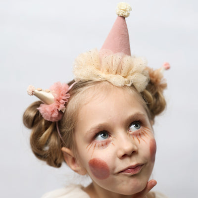 Diadema con sombrero de fiesta rosa y crema