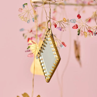 Hanging mirror with faceted back in black